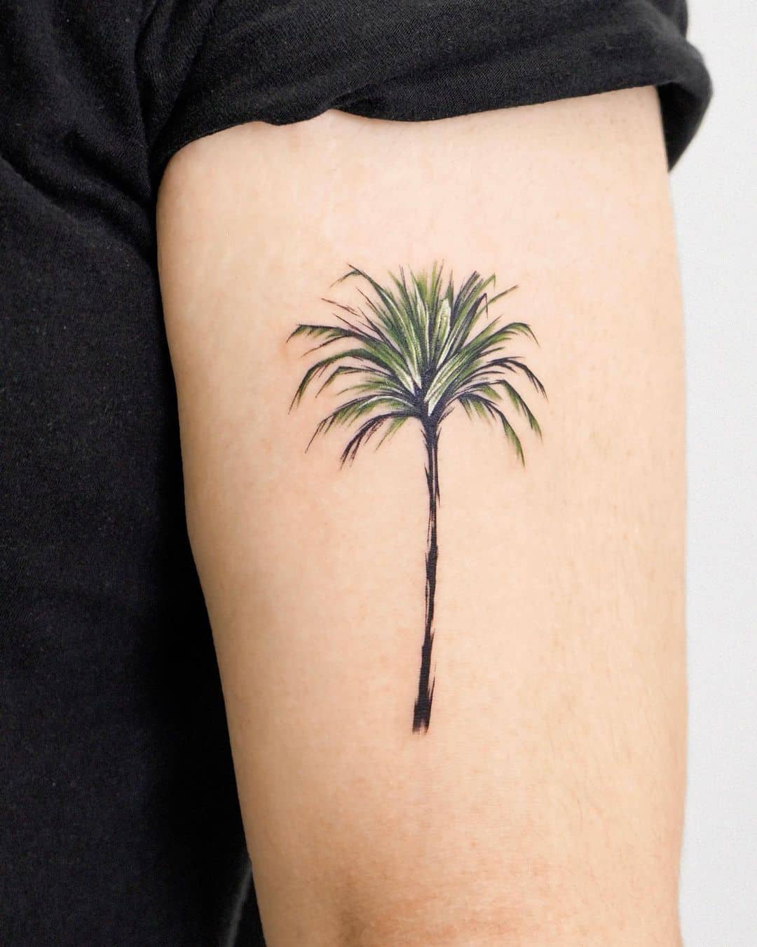 Palm tree tattoo by tattooist zela