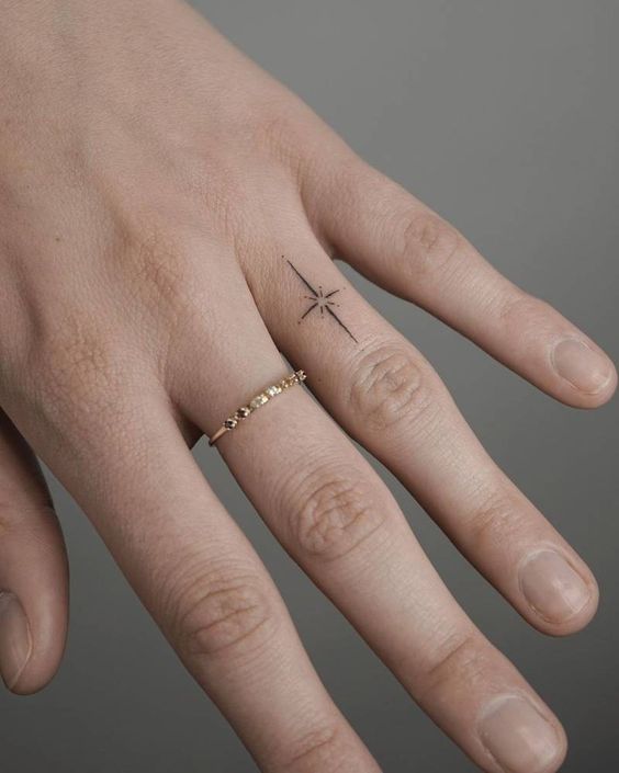 Star tattoo on finger 1