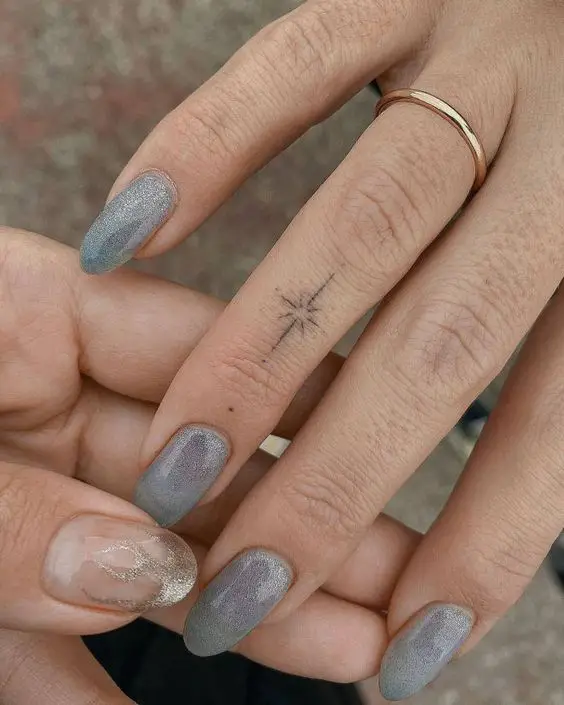 Star tattoo on finger 2