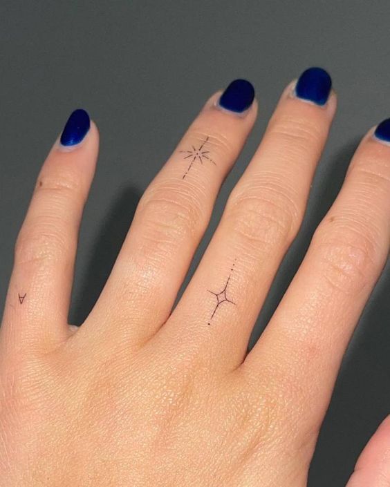 Star tattoo on finger 4