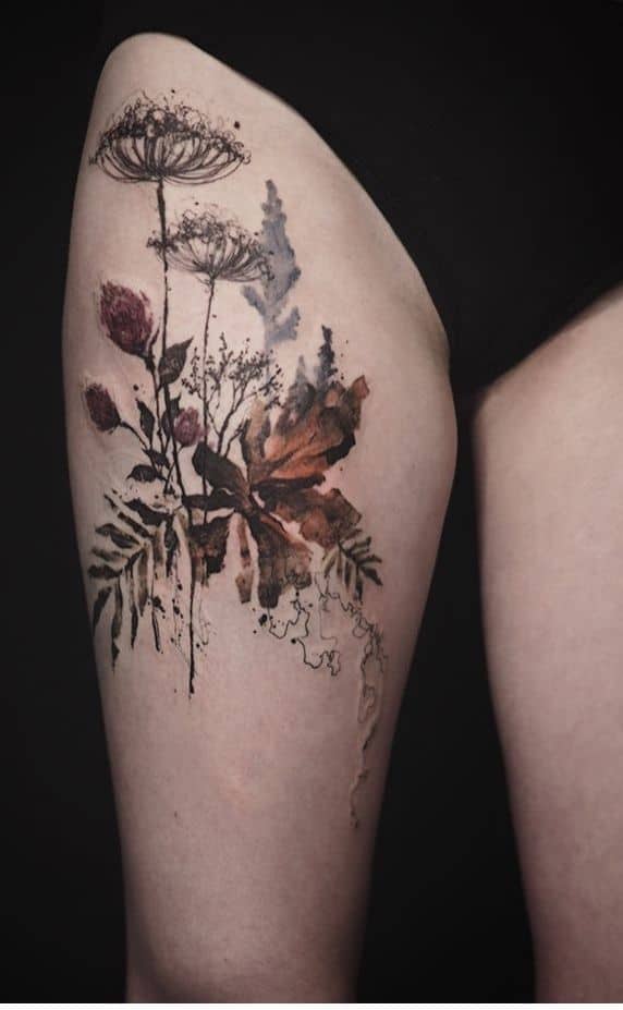 Abstract flower tattoo on leg 2
