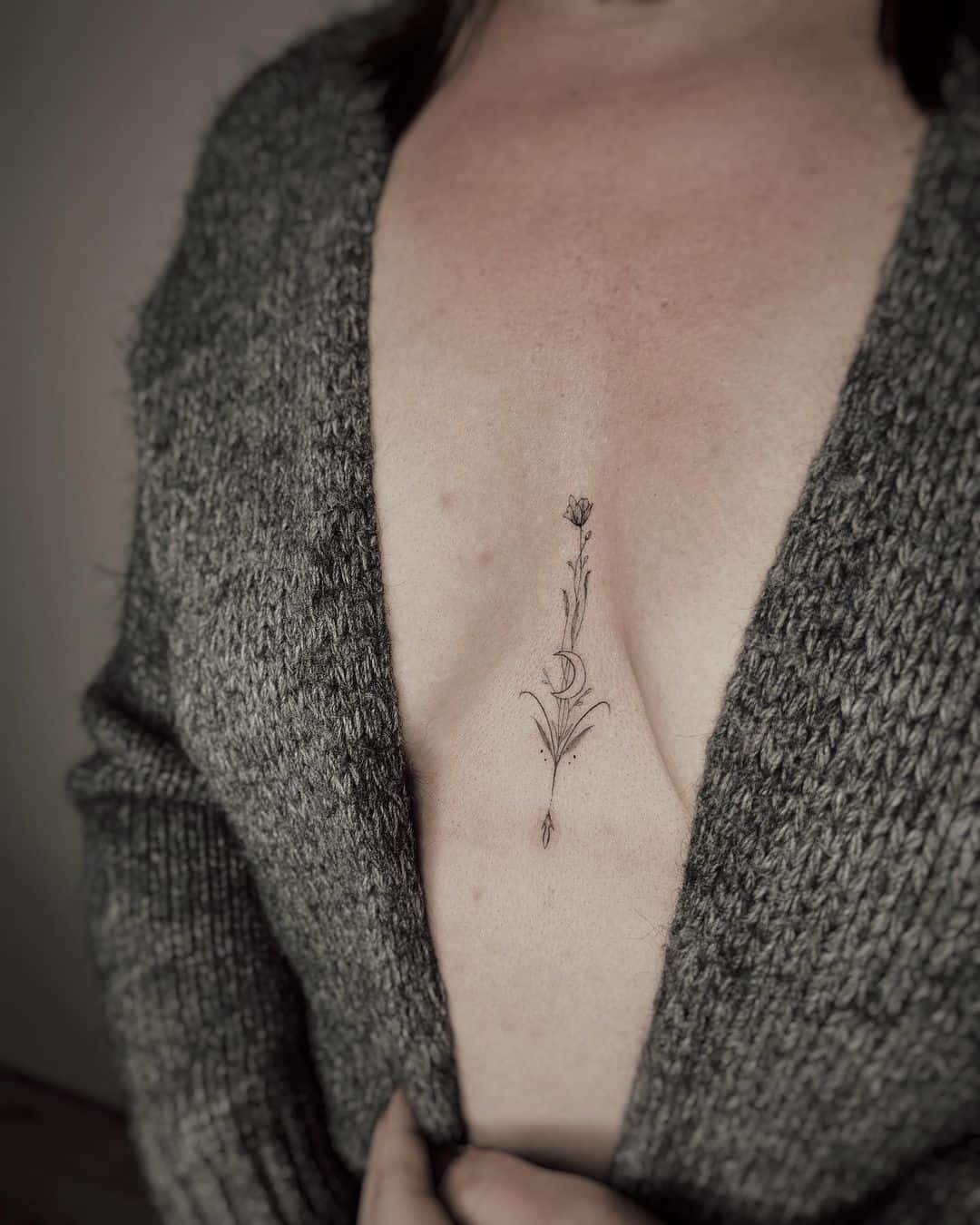 Minimalist Aries constellation tattoo on the forearm.