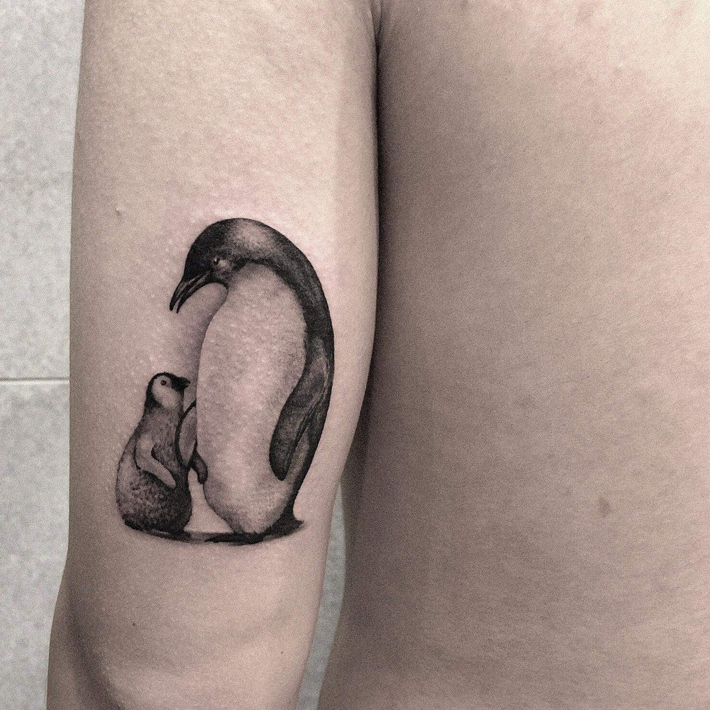 Black adn white penguin tattoo design by inktalktattoostudio
