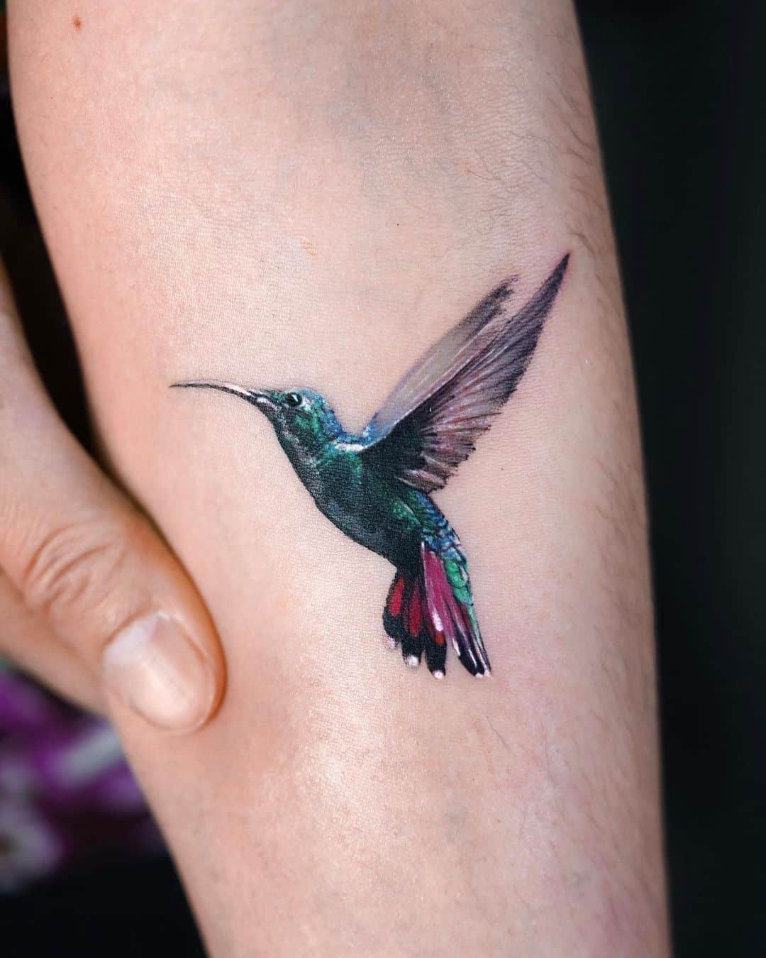 Colorful humming bird tattoo by stuffie.ink