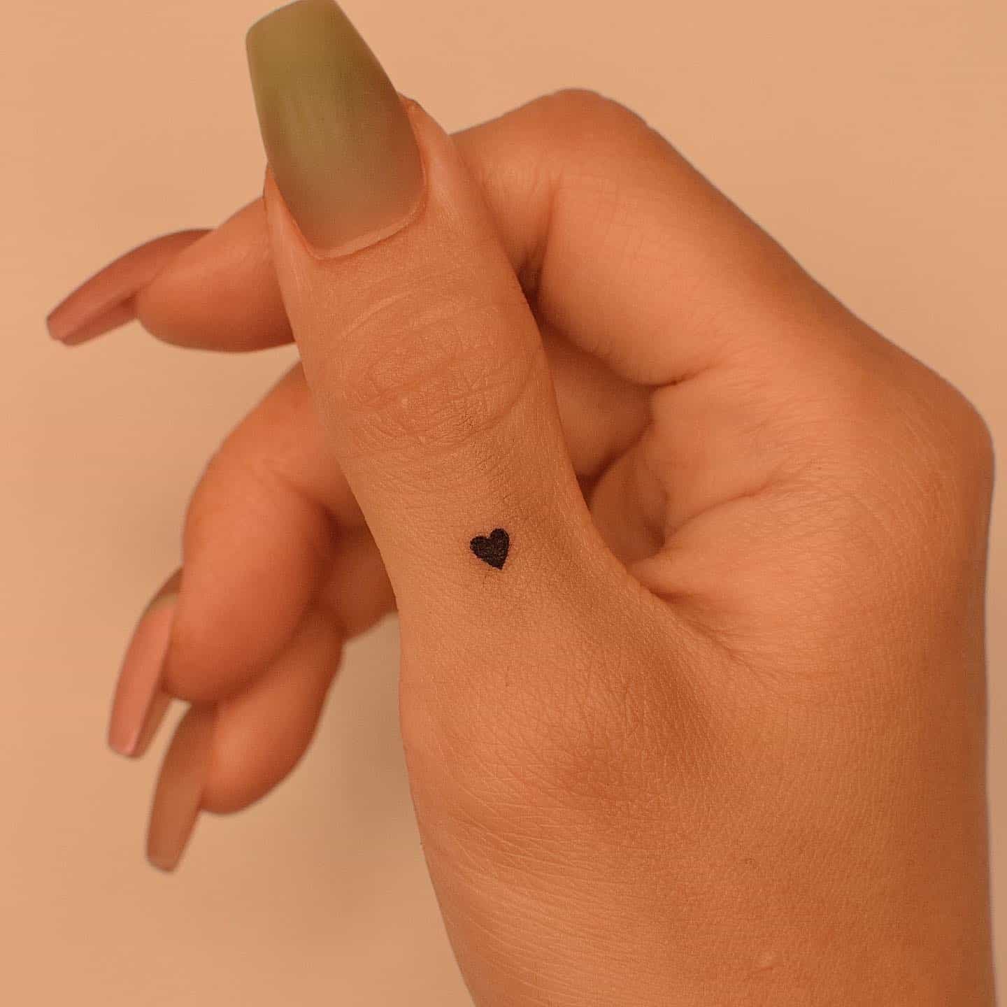 Cute heart tattoo by tattooer jina