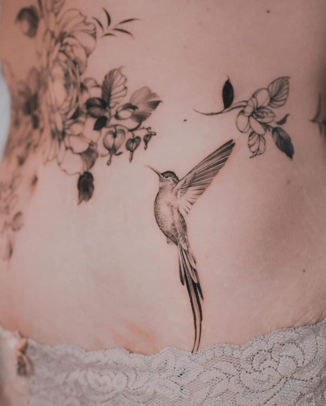 HUmming bird with flowers by karolinaszymanska tattoo