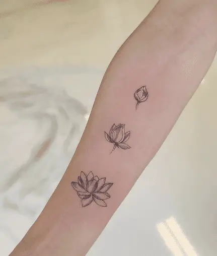 Lotus forearm tattoo by kimchuink