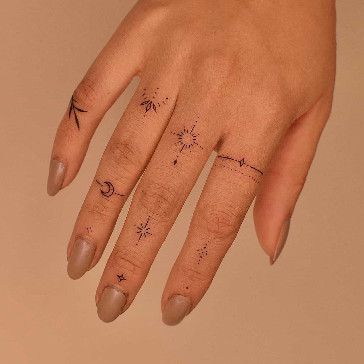 Mini finger tattoo by tattooer jina