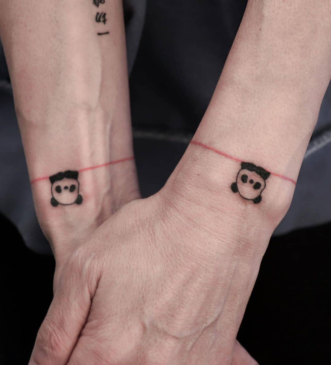 Minimalistic panda tattoo by sadi tattooer