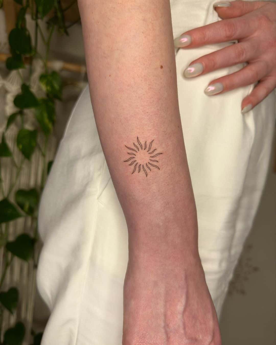 Minimalistic sun tattoo design by tubitta