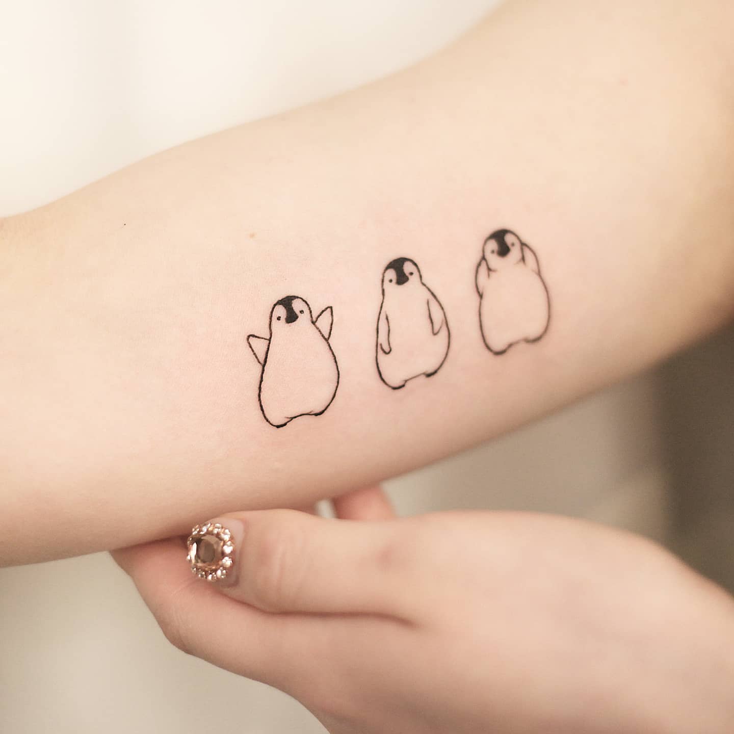 Penguin tattoofor women by vandal tattoo
