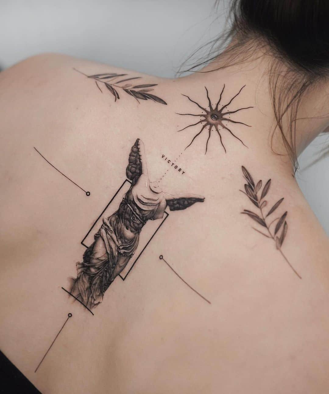 Realistic back tattoo by ogitattooer