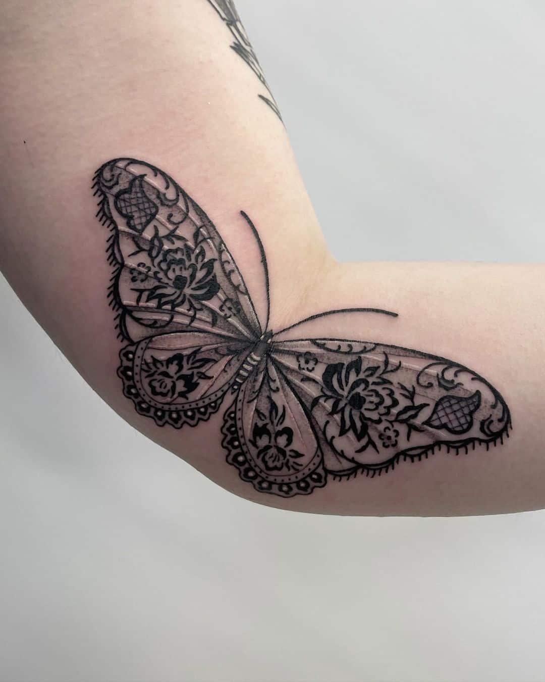 Realistic butterfly tattoo by