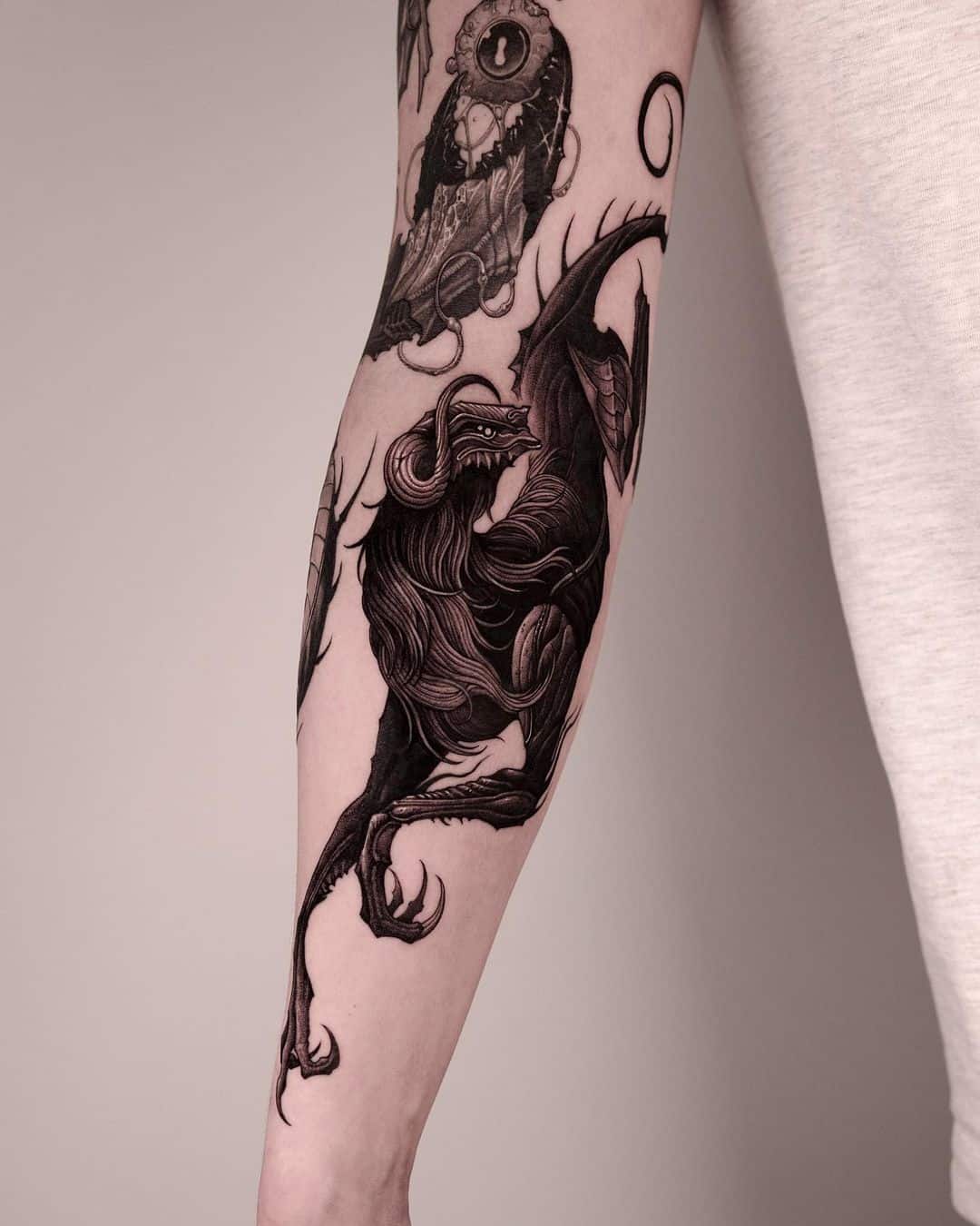 Realistic forearm tattoo by 47volt