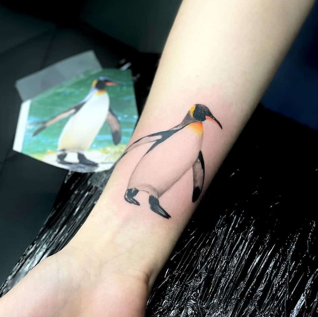 Realistic penguin tattoo by mario tats