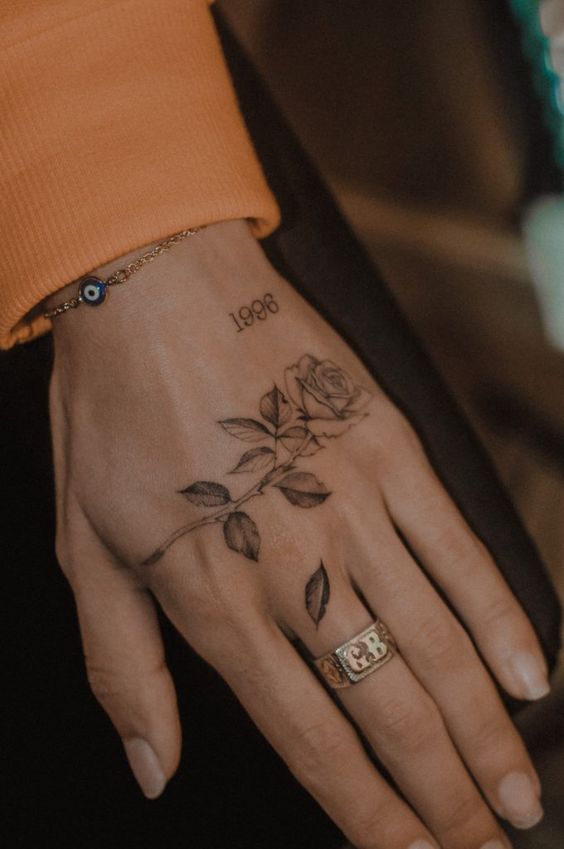 Rose on hand tattoo 3
