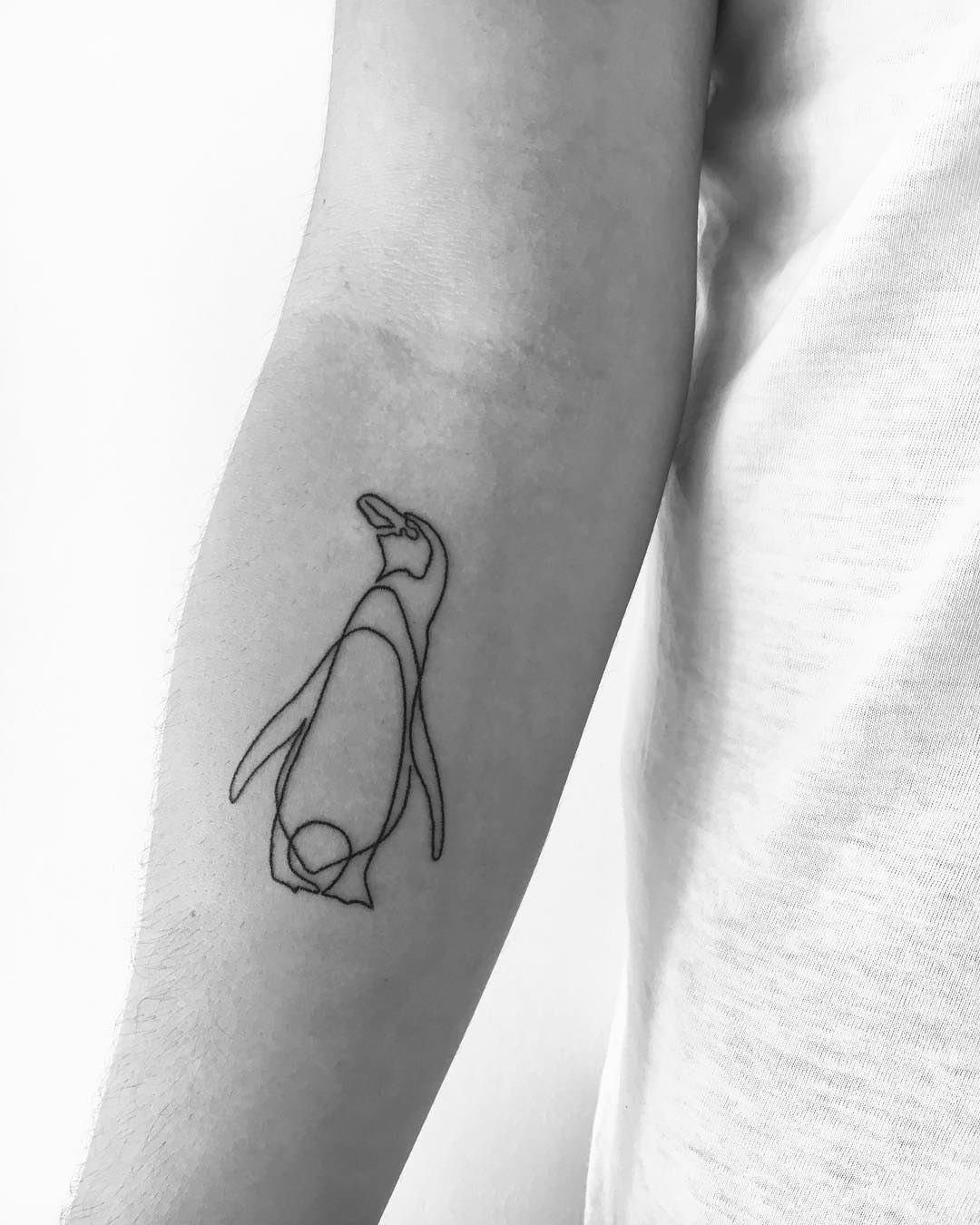 Simple penguin tattoo by vito.handpoke