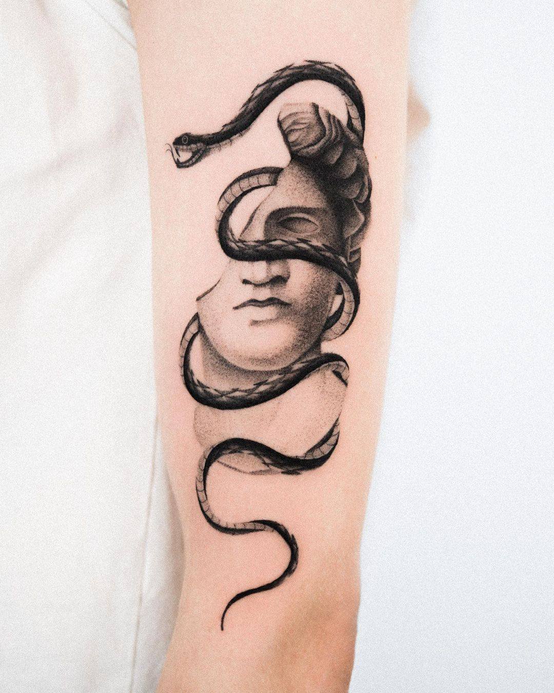 Snake tattoo by mauritziantetattoos