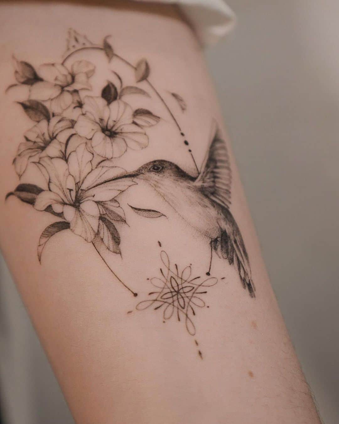 minimalistic bird tattoo by ela fine tattoo