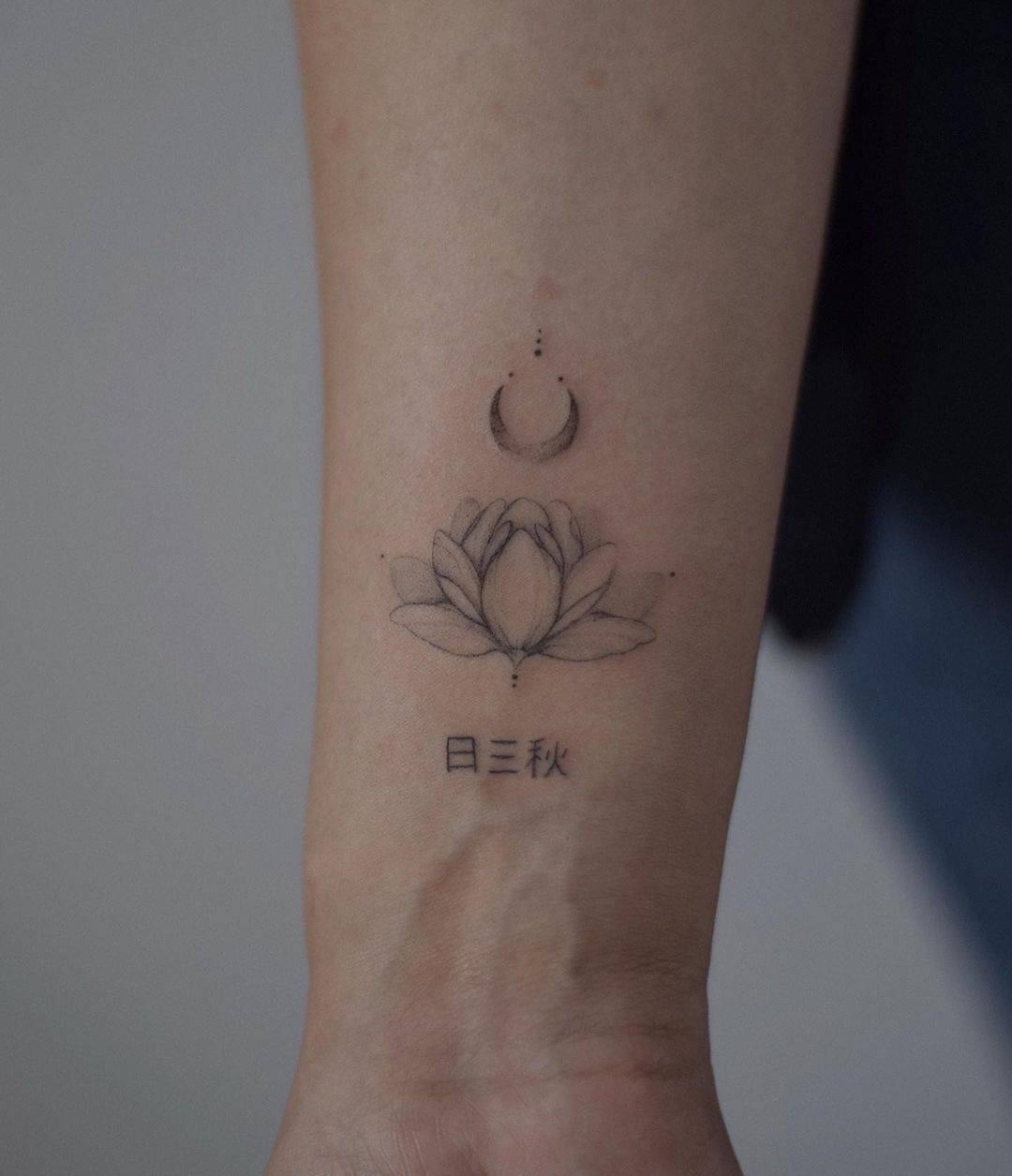 small lotus tattoo by shari tattooer