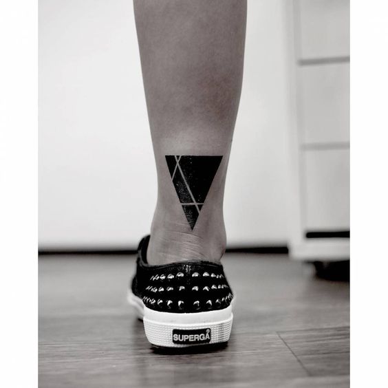 Abstract triangle on leg tattoo 1