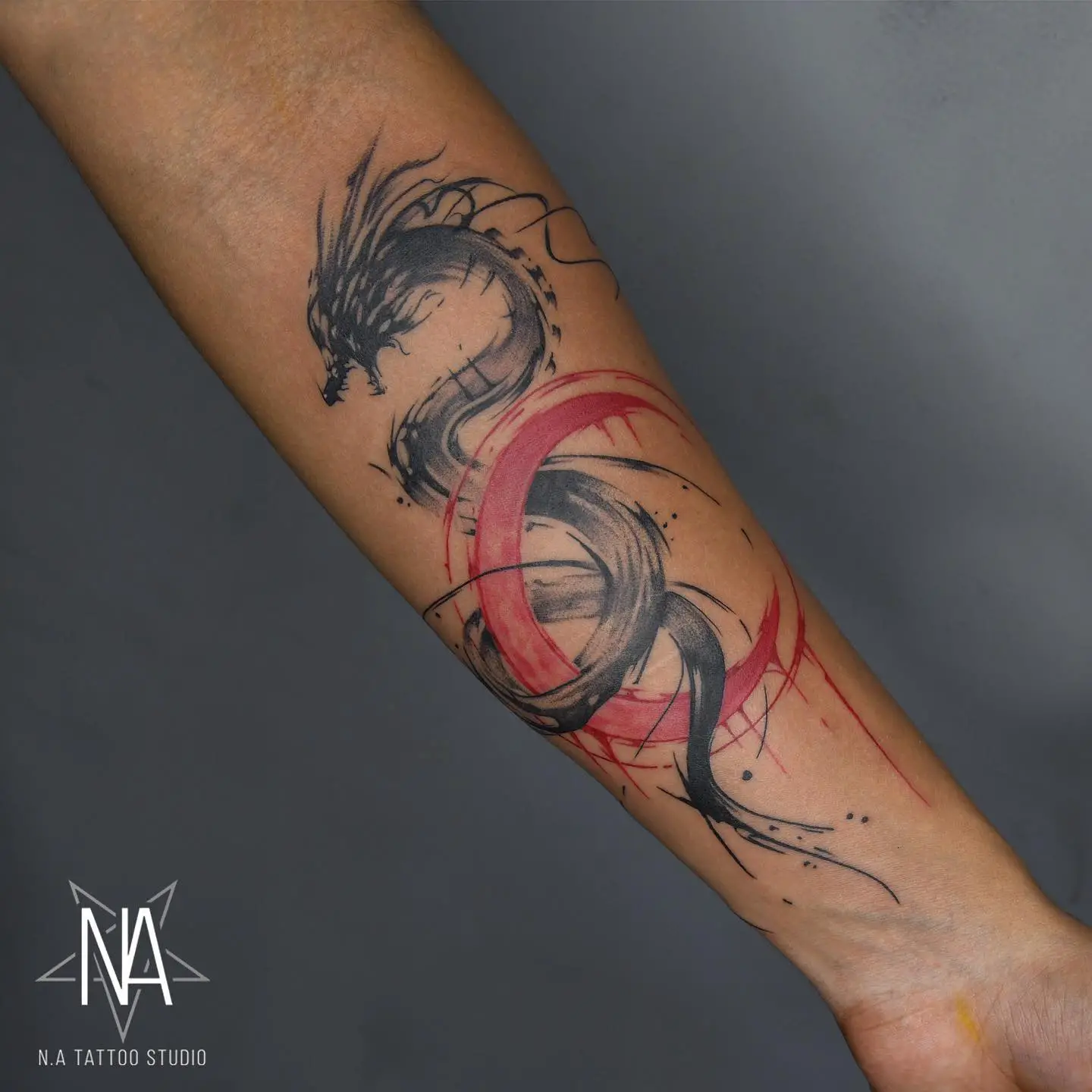 Black dragon tattoo by natattoostudio