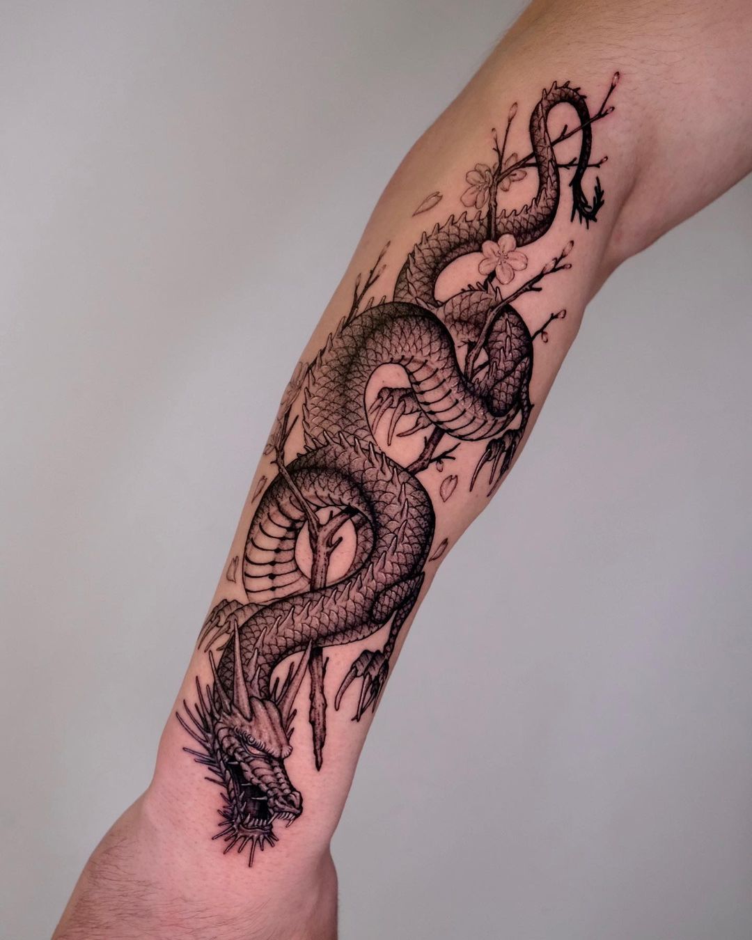 Dragon forearm tattoo by