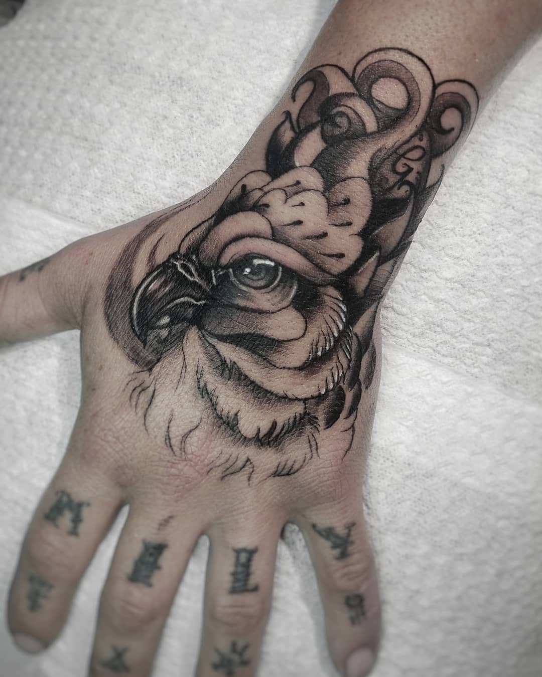 Eagle on hand tattoo by
