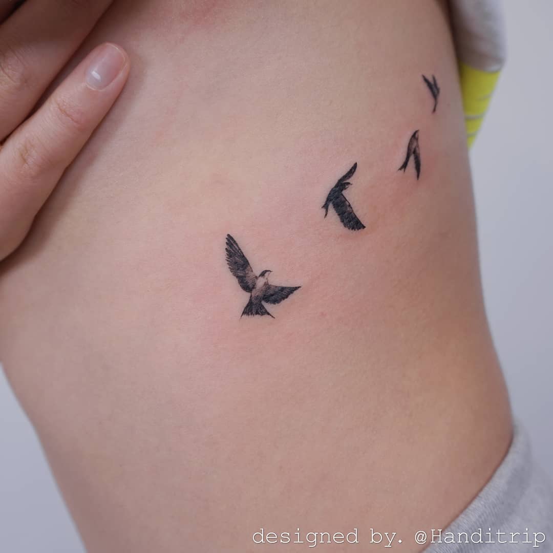 Flying bird tattoo design by handitrip