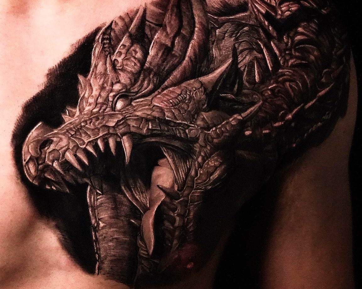 Realistic dragon tattoo by kazin tattooer