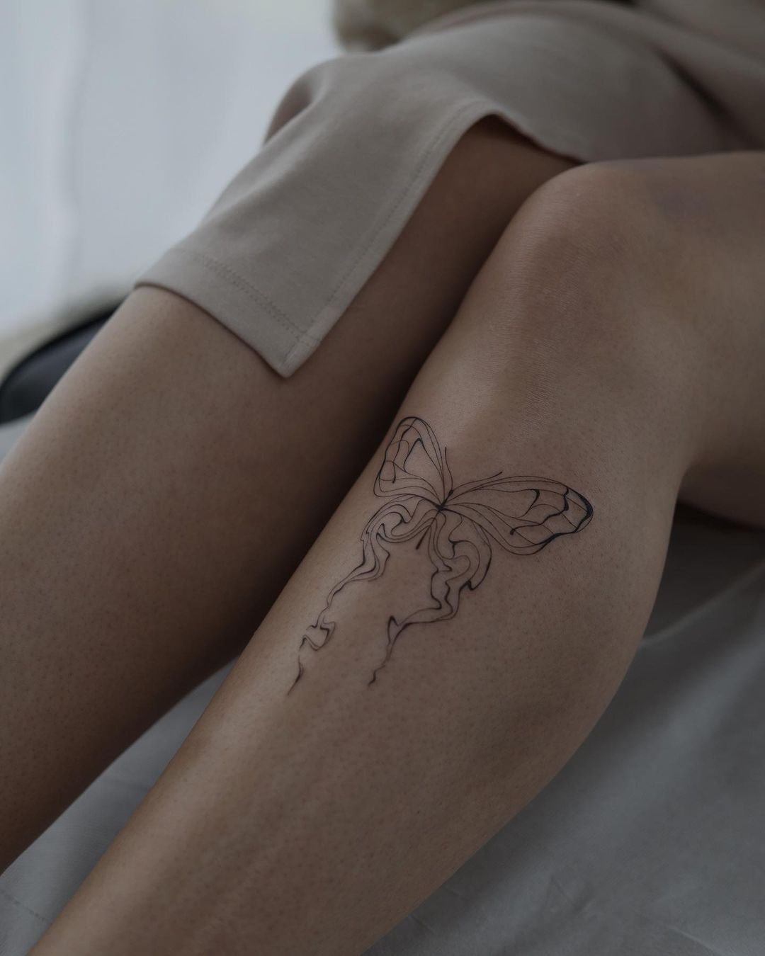 Simple butterfly tattoo design by akkurat tattoo