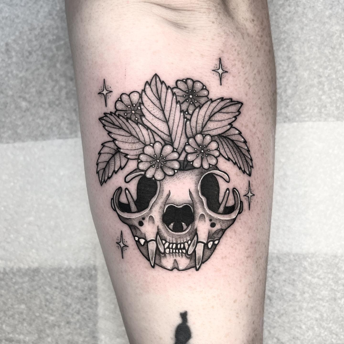Simple skull tattoo by draculatattoos