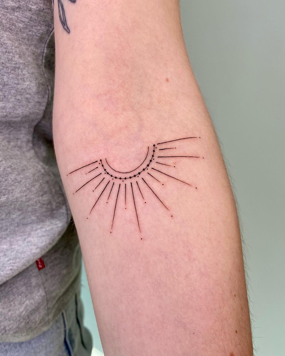 sun tattoo design by indigo tattoo studio