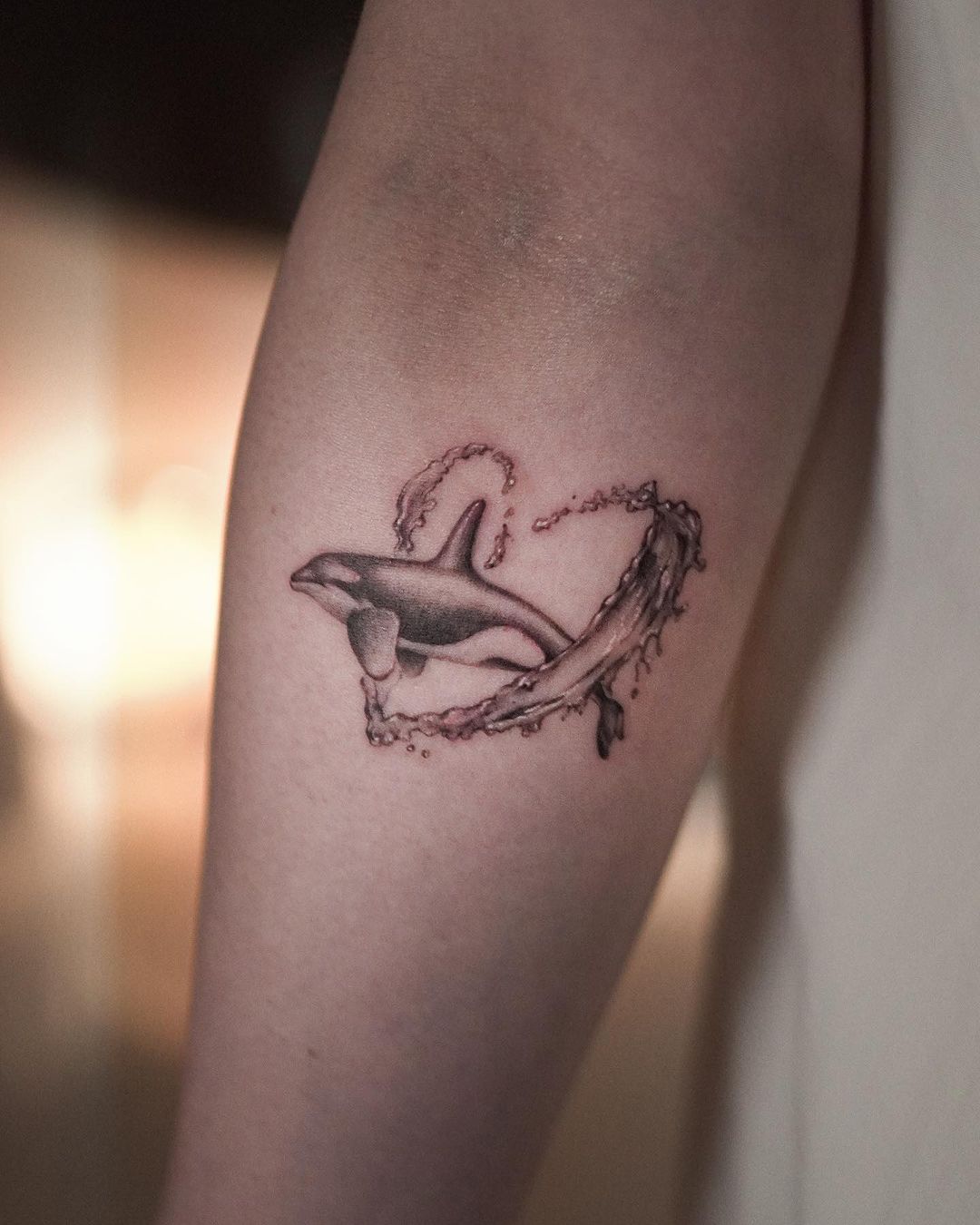 Black inked dolphin tattoo design by e1 tattoo
