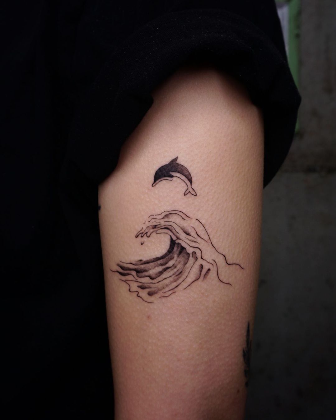 Black inked dolphin tattoo design by meet meat