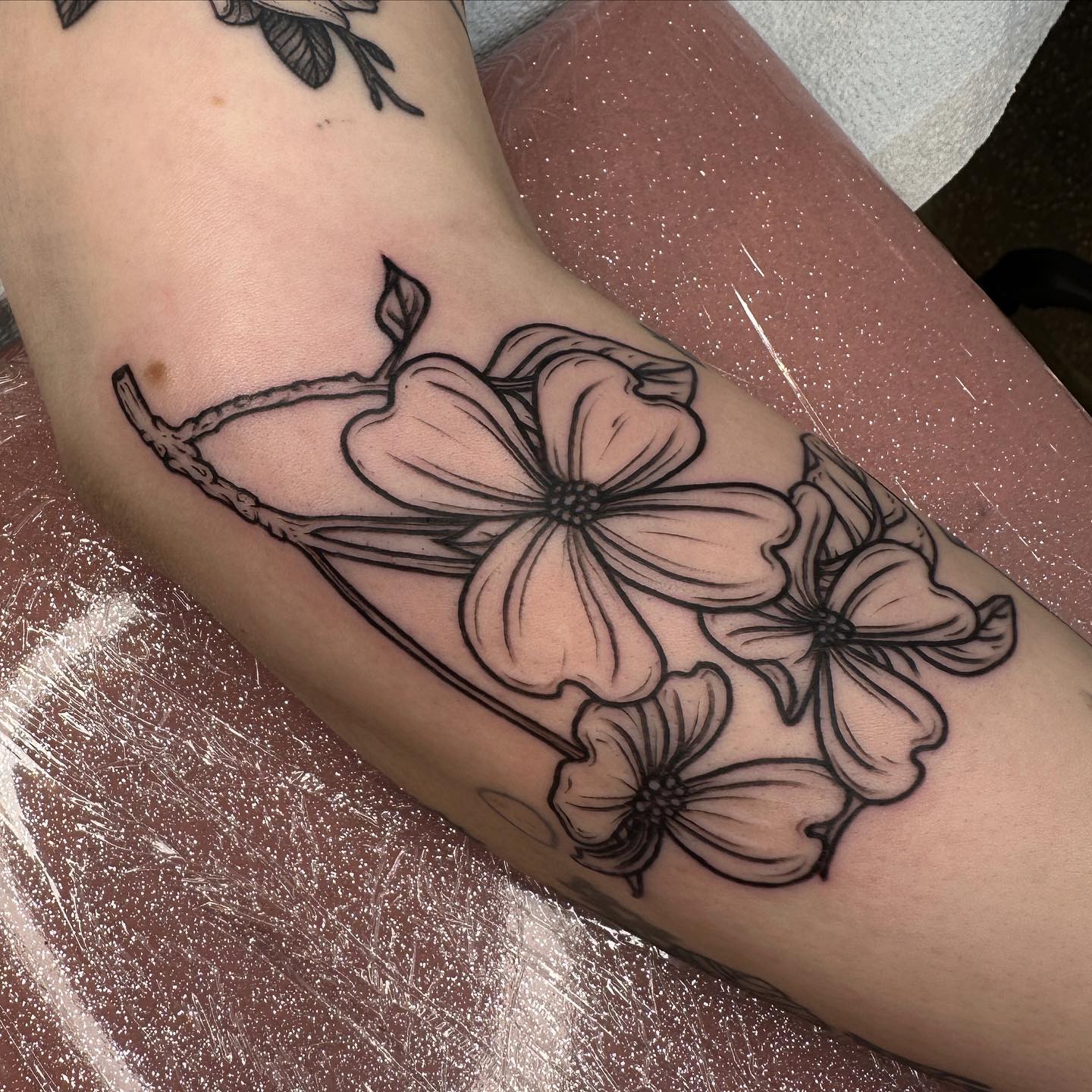 Black inked flower tattoo by rosalieocchino