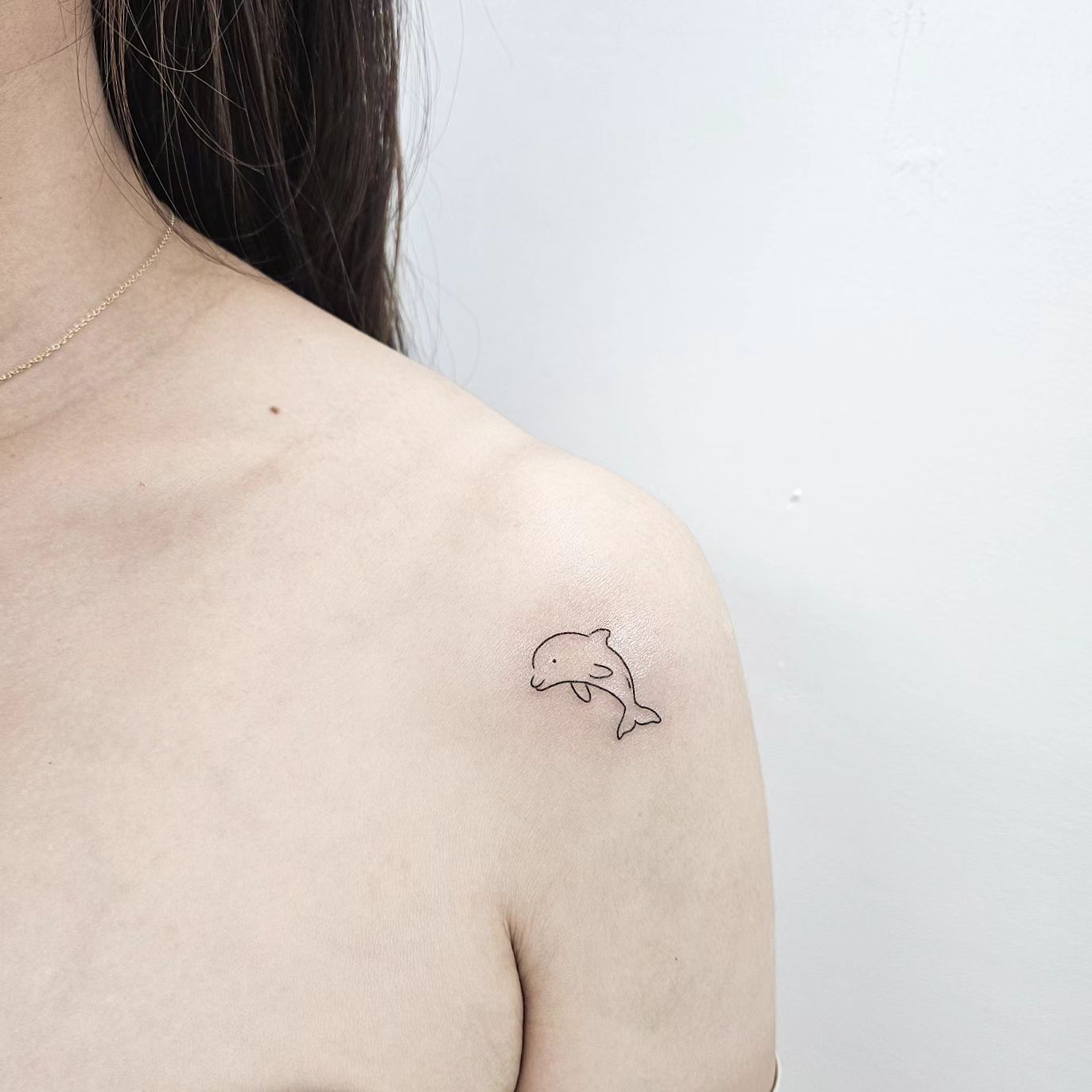 Simple dolphin tattoo by moonda tattoo