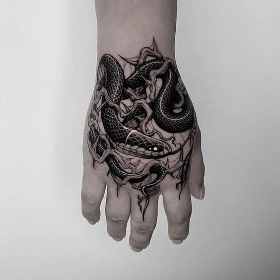 amazing snake hand tattoo for men