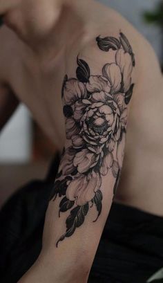 black inked flower design on shoulder