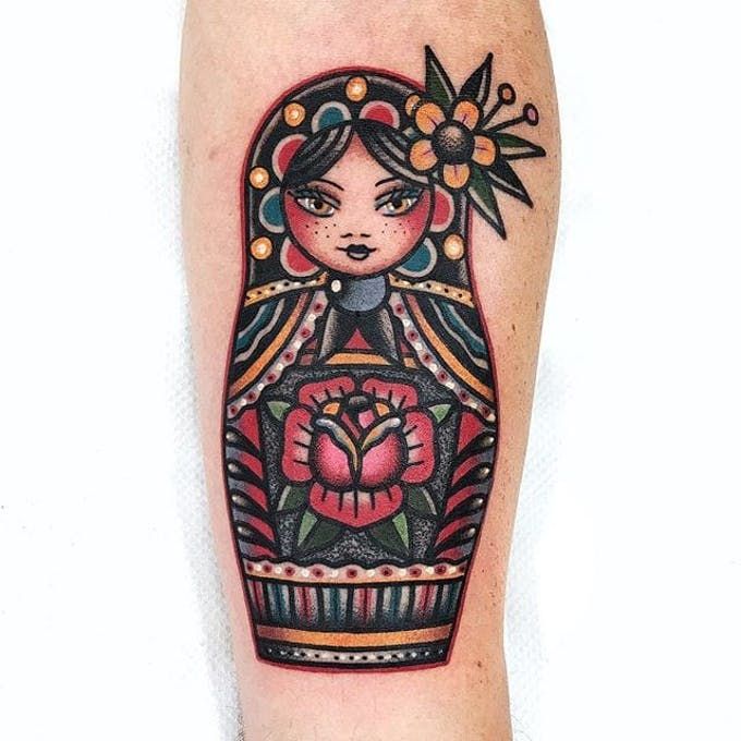colorful traditional doll tattoo