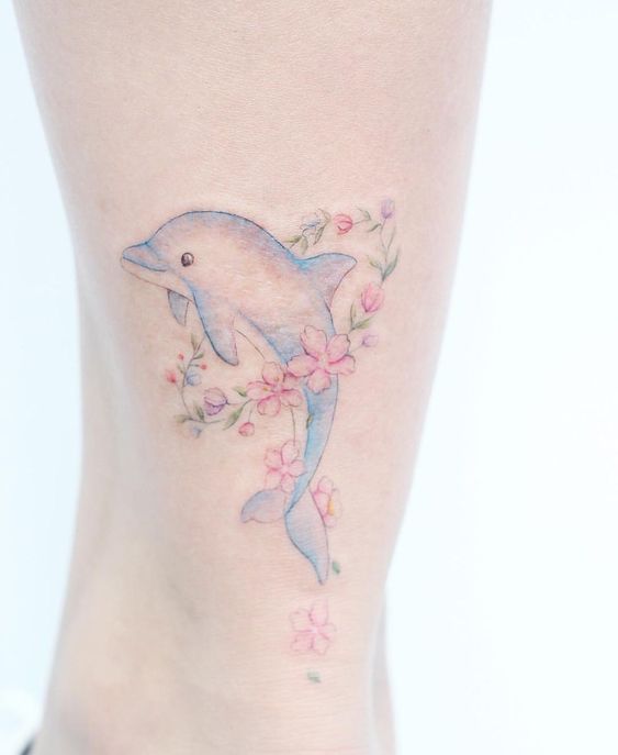 floral dolphin tattoo