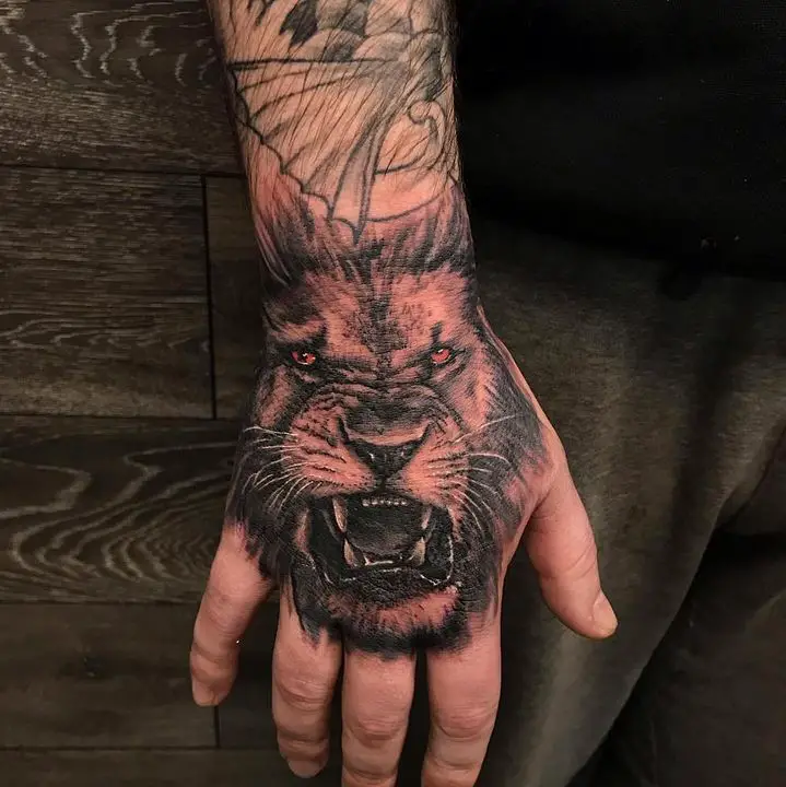 lion tattoo on hand by neotokyo edinburgh