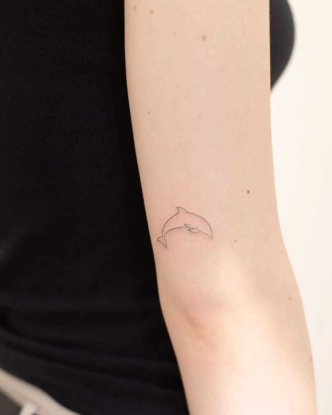 simple dolphin tattoo by daf647.ink