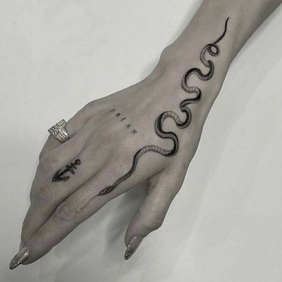 simple snake on hand tattoo ideas