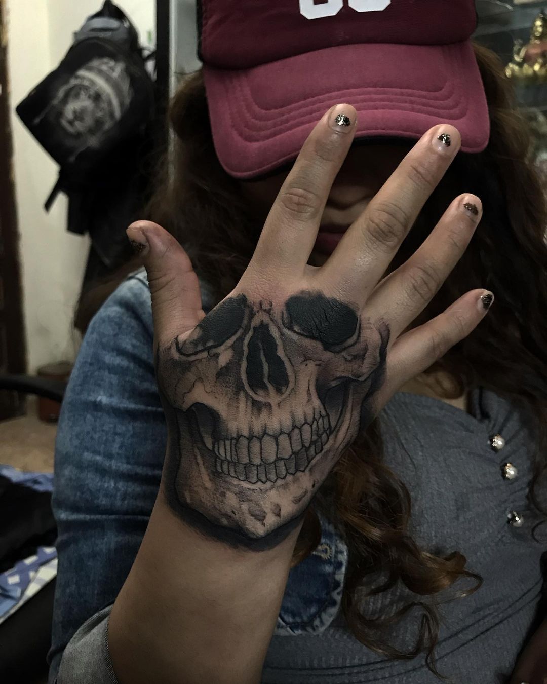 skull tattoo on hand by pachukotattoo