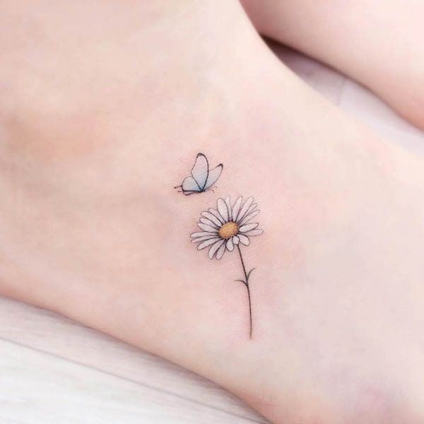 small flower tattoo with butterfly for men