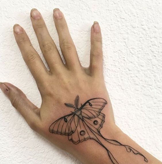 small insect tattoos on hand