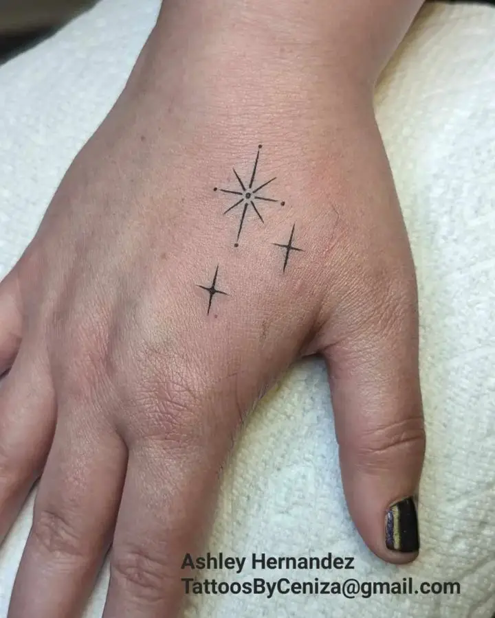 star tattoo on hand by blackhearttattoocollective