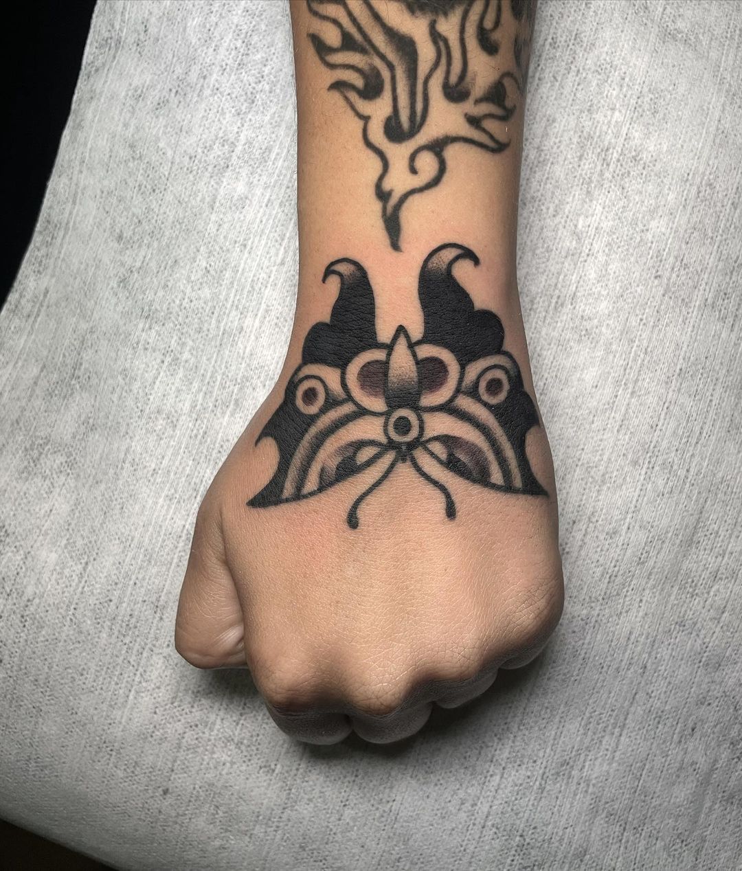 traditional hand tattoo by tattoosbydrops