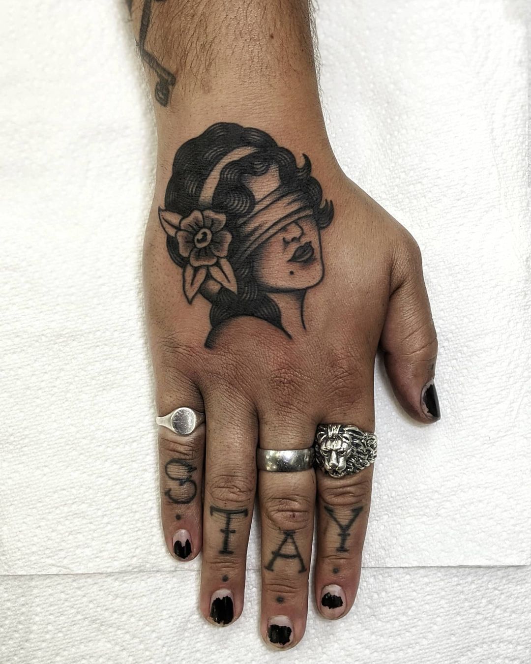 traditional hand tattoo design by dquinn.tattoo